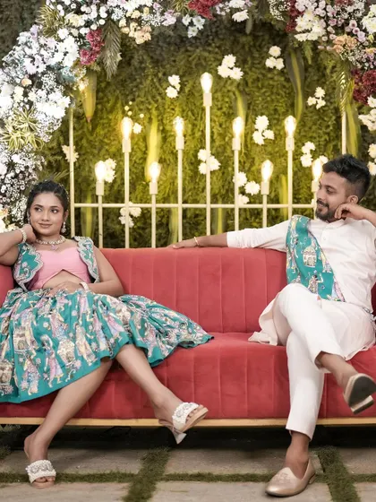 A fun and candid shot from a Mehendi night. The couple looks so happy and relaxed, enjoying their celebration.