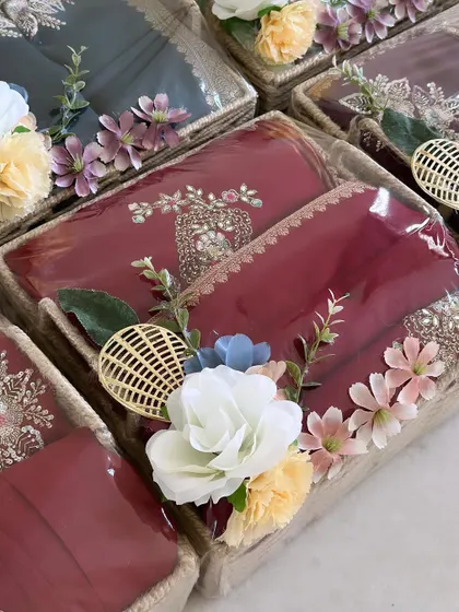 Another angle of our jute basket trousseau packing. The combination of traditional fabrics and rustic packaging creates a unique and charming aesthetic.