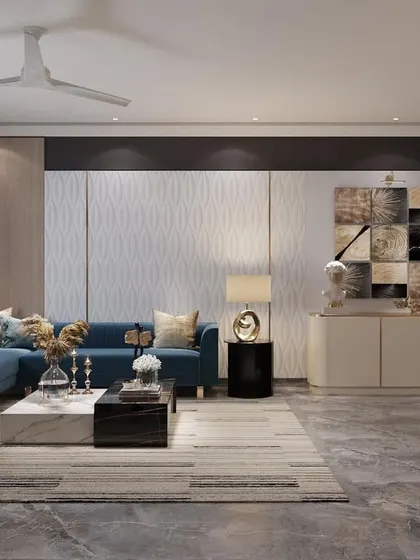 An informal lounge area designed to relax and watch TV after a long day. The space features a comfortable blue L-shaped sofa, modern art, and a built-in credenza for storage.