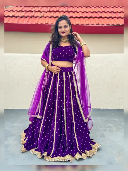 Another look at the custom purple velvet lehenga, perfect for dandiya nights or any grand celebration.