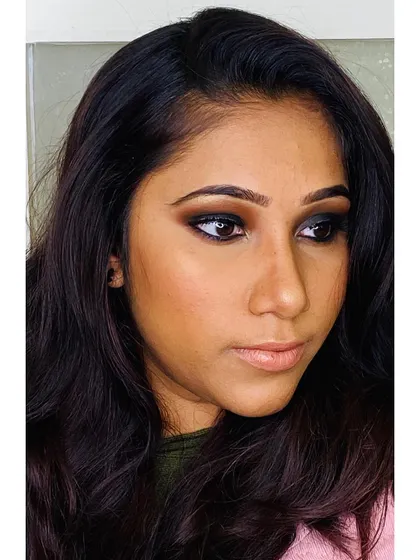 A three-quarter view of the intense smokey eye makeup. I focus on blending to ensure the look is dramatic but not harsh, creating a sultry and sophisticated effect.
