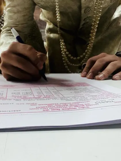 This shot captures the moment of signing the official marriage registration form. My focus is on the procedural details so you can focus on your special day.