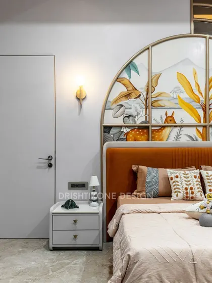 Designing for kids is all about sparking imagination. This room features a beautiful, hand-painted nature mural within a custom arched headboard, creating a whimsical and serene space for a child to dream and grow.