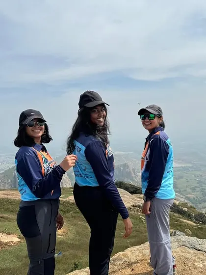 A group of three young women enjoying the view from the top. Our treks are a great way for friends to have an adventure together.
