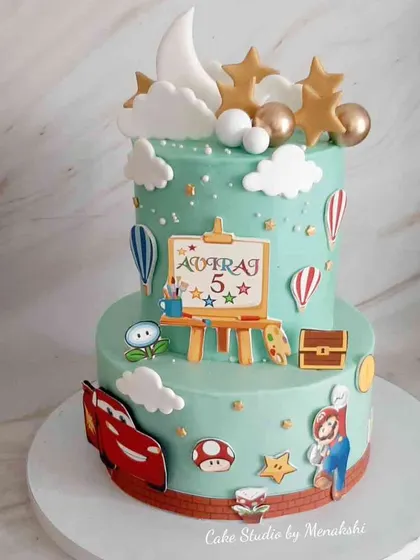 A beautiful two-tier cake featuring all of a 5-year-old's favorite things. This minimal fondant design includes elements from Super Mario, Cars, and painting.