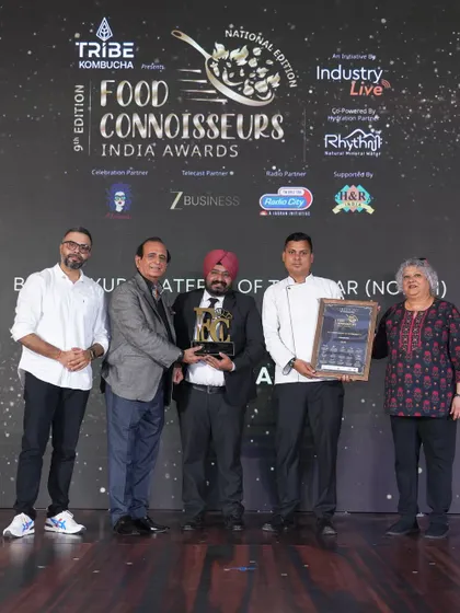 Our chef on stage, receiving the award for 'Best Luxury Caterer of the Year (North)'. A proud moment for the entire CAARA family.