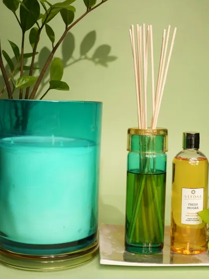 The fresh, green notes of our Fresh Mogra fragrance, captured in both a candle and a reed diffuser. The vibrant green and turquoise glass adds a pop of color to your decor.