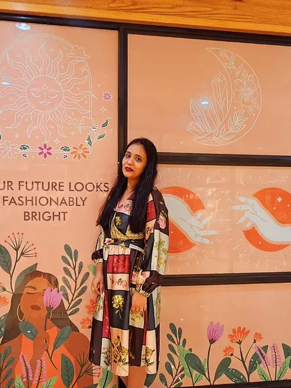 Standing in front of a beautifully illustrated wall at the Vero Moda event. The message "Your future looks fashionably bright" perfectly matched the optimistic energy of the day.