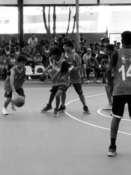 A moment of intense action from an NBA event in Bangalore. One of our U16 players skillfully handles the ball against tough defenders, putting his training into practice in a high-stakes environment.