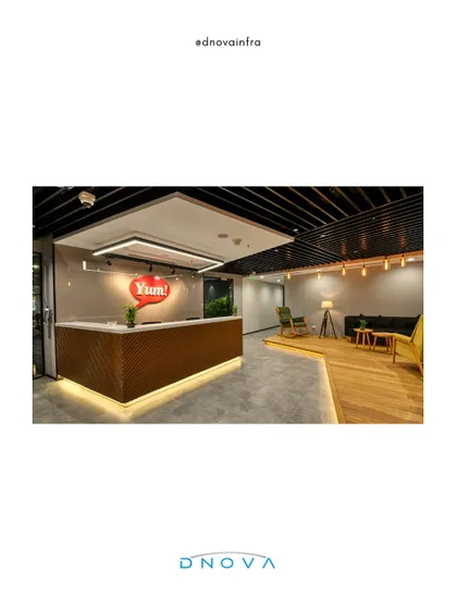 The reception and waiting lounge for YUM! Digital & Tech features a mix of modern furniture and warm wood tones. As the general contractor, I ensured the execution matched the design's intent for a collaborative and welcoming tech office.