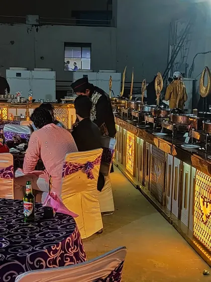 A full buffet setup with elegant chafing dishes and professional service staff. I ensure the catering is not just tasty but also presented beautifully.