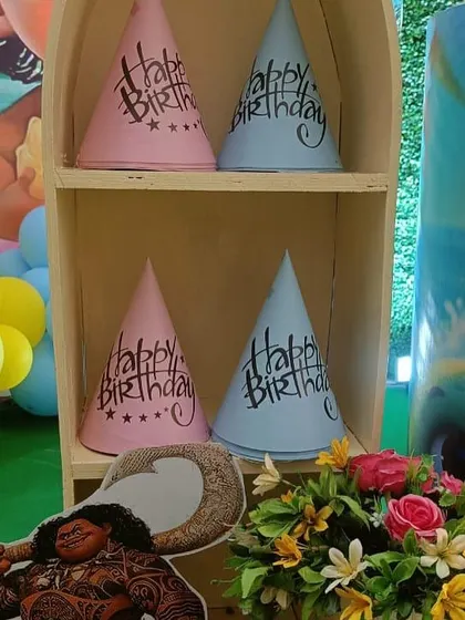 Themed party hats are a fun detail we can arrange. These were part of a Moana party package, adding to the immersive experience for the kids.