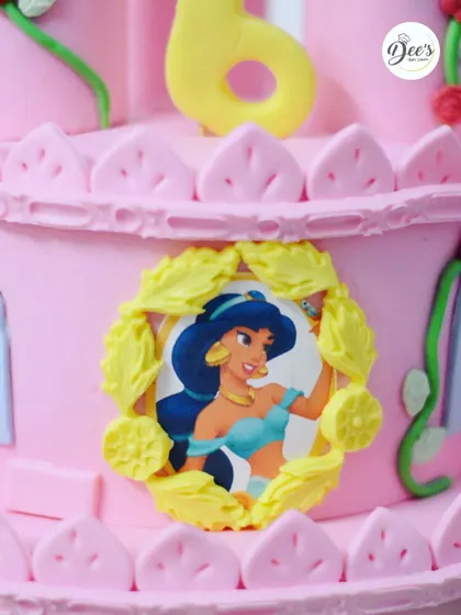 A close-up of the Princess Jasmine detail, framed with delicate yellow leaves, adding a touch of royal elegance to the castle wall.