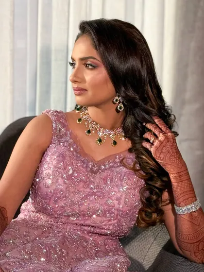 A candid moment, with the client looking effortlessly beautiful in her reception gown.