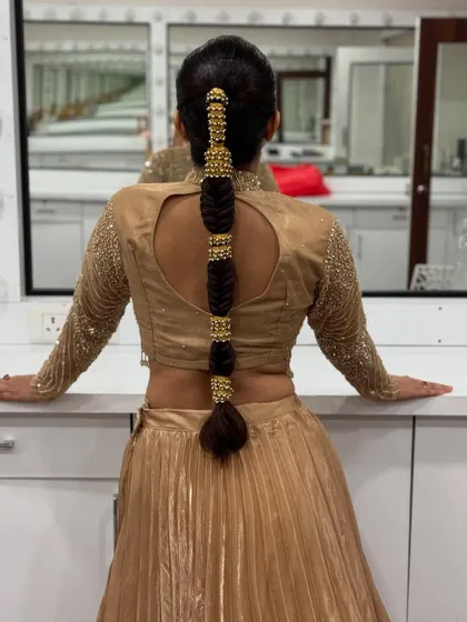 A full view of the modern bubble braid, showcasing the beautiful gold accessories and the sleek finish. This style is both elegant and on-trend.