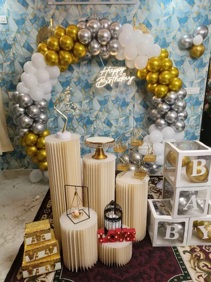 A sleek and modern birthday setup with a metallic gold and silver balloon ring, perfect for a stylish party.