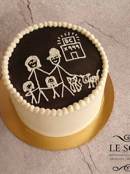 This cake was based on a drawing sent by my client. I recreated their family stick-figure drawing in white chocolate on top of a dark chocolate ganache for a truly personal touch.