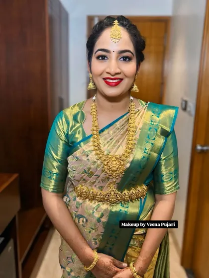 A full-length view of a classic South Indian look. The makeup is flawless from every angle, ensuring the client looks perfect throughout her event.
