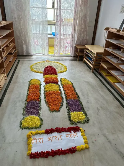 A full view of our Chandrayaan pookalam in our Montessori classroom, showcasing the beautiful intersection of art, culture, and current events.