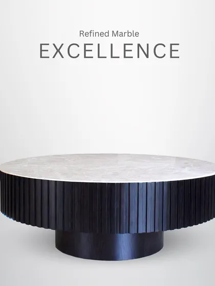 Refined marble excellence. This round table features a dark, fluted base and a light marble top, creating a beautiful contrast and a sophisticated focal point.