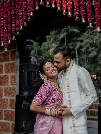 A playful and romantic moment on the steps of The Peacock Grove. We encourage our couples to be themselves, which allows us to capture their unique personalities and connection.