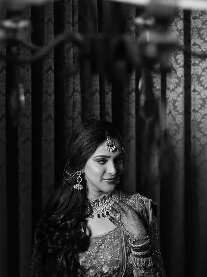 A timeless black and white bridal portrait. The soft lighting and classic composition give this image a sense of elegance and nostalgia.