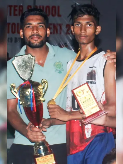 A proud moment with one of our gold medal-winning Kho-Kho players and the championship trophy.