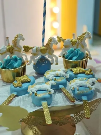 More delicious details from the carnival party. These cakesicles and cupcakes with carousel horse toppers were almost too pretty to eat.