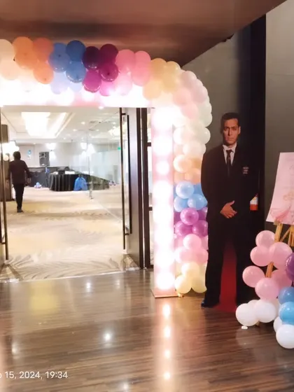 The entrance setup includes easel stands for welcome signs or event schedules, which we can integrate into the overall decor scheme.