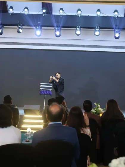 A moment of intense focus during a mind-reading routine for a real estate event. I specialize in turning thoughts into numbers and creating a magical reveal for the audience.
