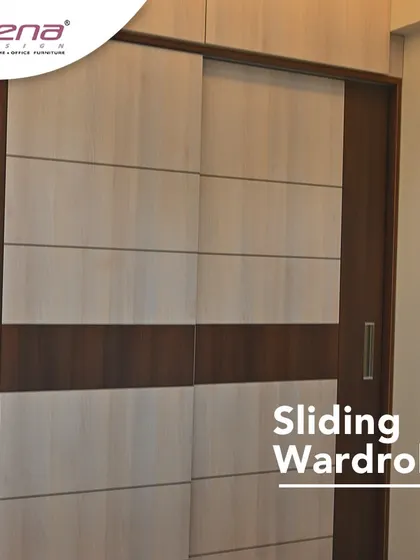 A sliding wardrobe is a great space-saver for compact rooms. This design features a dual-tone wood finish for a modern and clean look.