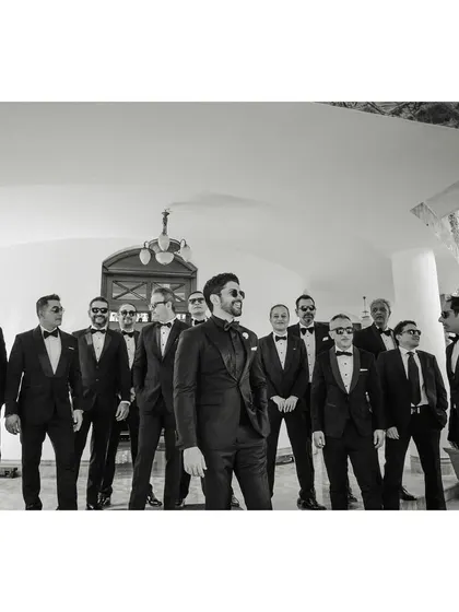 The "BWOYs" arrive. Farhan and his groomsmen make a stylish entrance in their tuxedos. This black and white shot has a classic, cool, and cinematic feel.