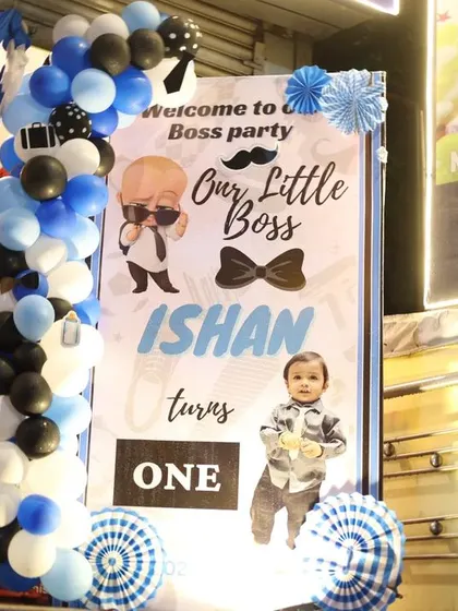 A personalized welcome banner for a Boss Baby themed naming ceremony and first birthday party.