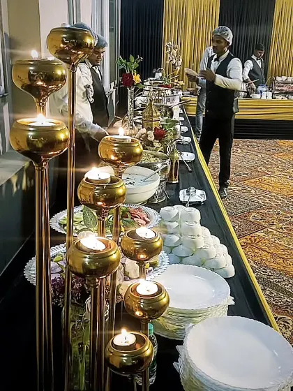 Candlelight adds a touch of elegance to this evening buffet. We pay close attention to details like lighting and decor to create the perfect mood.