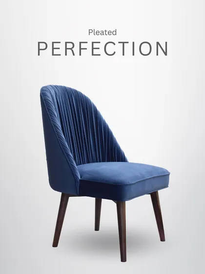 Pleated perfection. This dining chair in a rich blue velvet features an exquisitely pleated back, adding a touch of art deco glamour and texture.