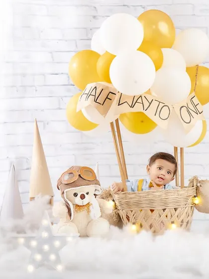 Another view of our little pilot, peeking out from his hot air balloon, ready for adventure.