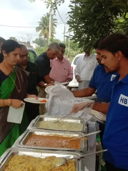 Our team serving guests at an outdoor buffet setup, demonstrating our flexibility for any event location.