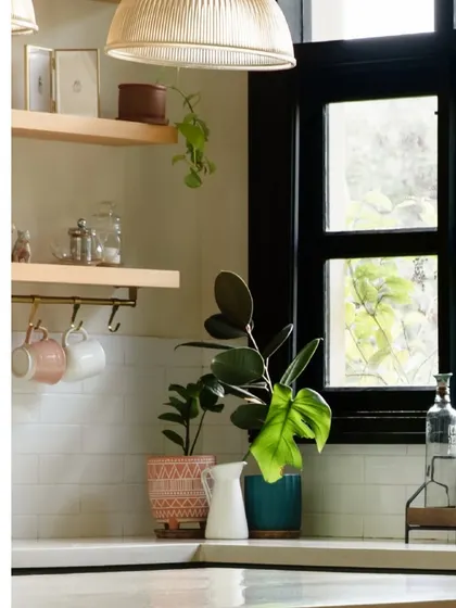 A corner of the kitchen, where natural light highlights the simple, beautiful details. We use plants and natural materials to bring life into every room.