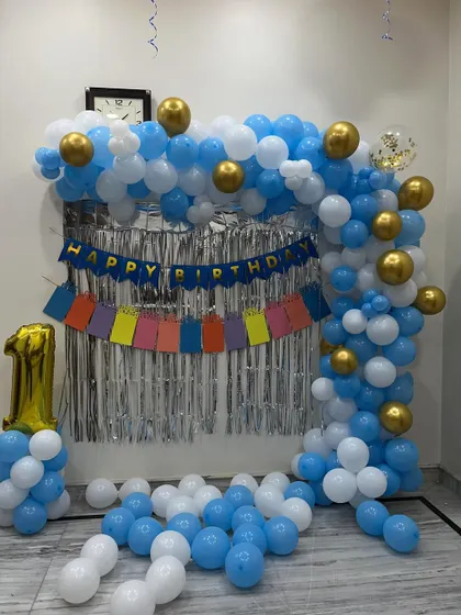 The complete balloon arch with gold chrome accents, perfect for a small celebration.