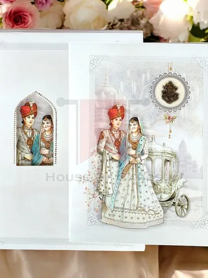A royal affair awaits. This stunning invitation features a majestic chariot and a beautiful Indian bride and groom, with an intricate cutout on the envelope for an added touch of elegance.