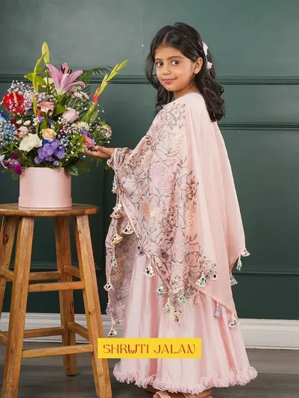 This little girl looks so graceful in my pink cape set. The flowing silhouette and delicate print make it a perfect outfit for creating magical and memorable moments.
