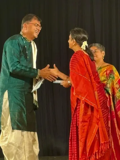 My husband T.V. Ramprasadh being felicitated on stage. His music is the soul of so many of our productions.