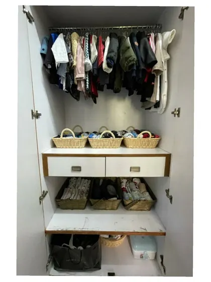 A closer look at an organized kids' wardrobe. Hanging jackets and party wear saves them from getting crushed, while baskets are perfect for everyday tees and shorts.