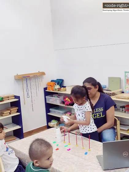 Here is a glimpse into one of our sessions, where a student learns through a hands-on activity with guidance from her teacher. We foster a supportive environment that encourages focus and discovery.