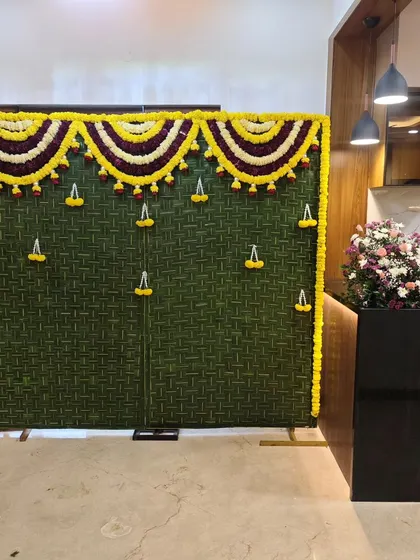 This traditional woven leaf backdrop is versatile and can be set up in any part of the home, instantly creating a sacred space for a pooja or ceremony.