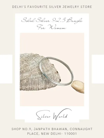A classic, solid round silver bangle. This timeless piece is a staple in Indian jewelry and is known for its durability and simple elegance.