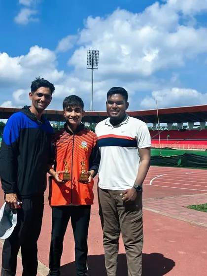 Yuv with his coaches at the national competition, a great example of the strong athlete-coach bond we foster.