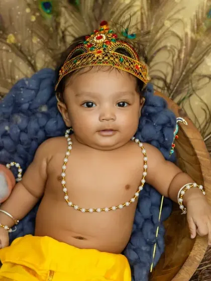A close-up of our little Krishna, looking so adorable in his festive attire.