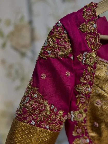 A detailed shot of the sleeve embroidery, showing the fine craftsmanship and beautiful color combination.