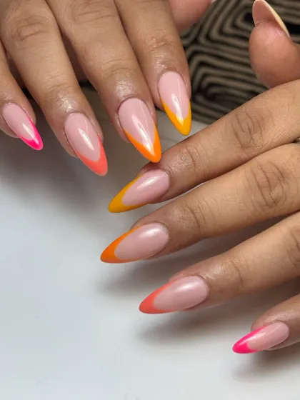 The full view of the sunkissed neon French manicure, with a mix of pink, orange, and yellow tips for a vibrant, tropical feel.